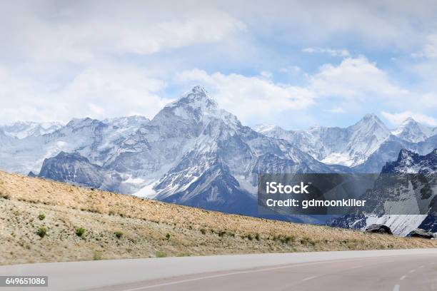 Snowcapped Mountain And Road Stock Photo - Download Image Now - Autumn, Backgrounds, Diminishing Perspective