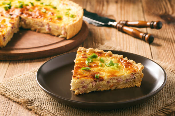 Traditional french pie with bacon and cheese - quiche lorraine. stock photo