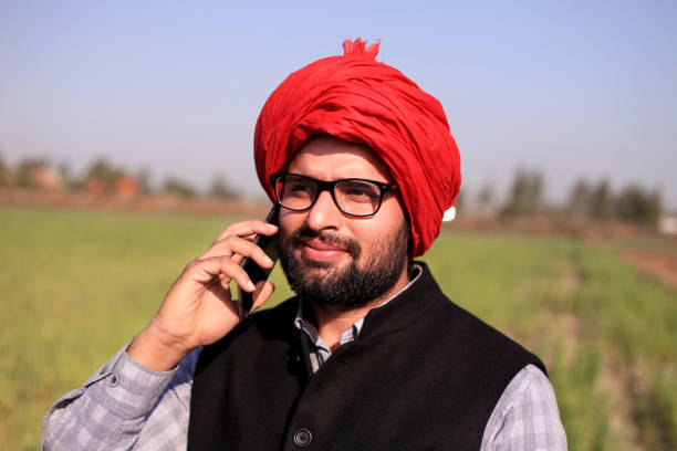 istock Indian men talking on mobile phone 649654146