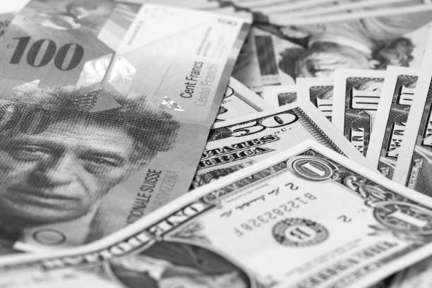 istock American and Switzerland money 649654468