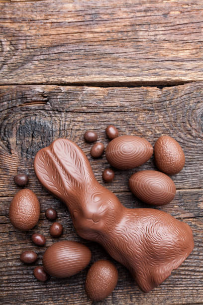 istock Chocolate Easter bunny and eggs on wooden background 649654692