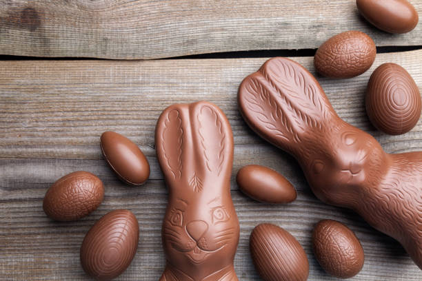 istock Chocolate Easter bunny and eggs on wooden background 649655002