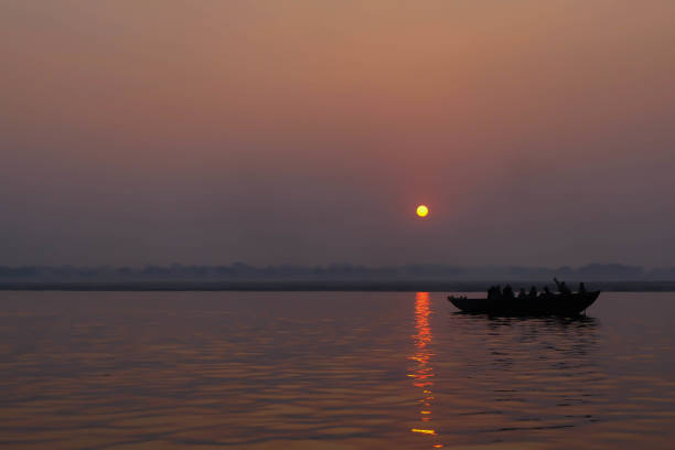 istock Silhoutte Old Fisherman boat at sunrise 649657154
