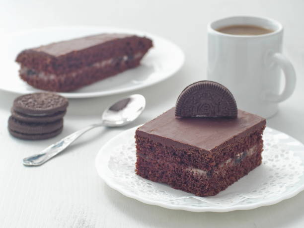 Piece of chocolate cake with Oreo cream filling stock photo