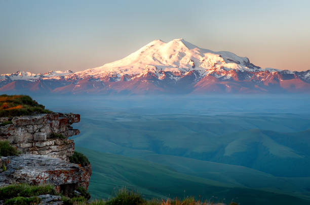 Elbrus on the sunrise, mountains in summer Elbrus on the sunrise, mountains in summer caucasus stock pictures, royalty-free photos & images