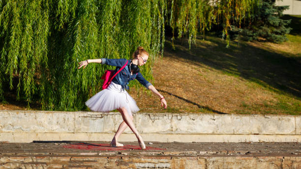 istock Ballerina hipster dancing on the street. 649664662