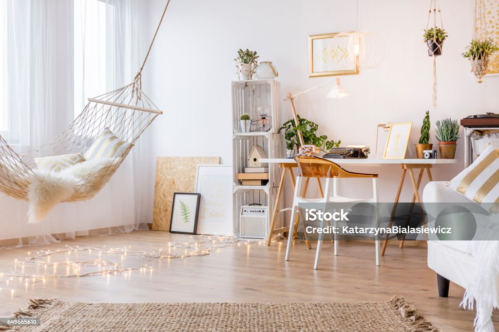 Cozy working place Cozy working place in the white room with hammock Boho Stock Photo