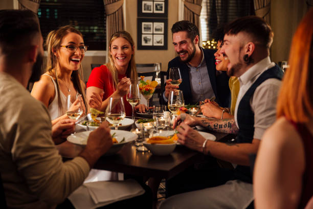 istock Friends Enjoying A Meal 649668984
