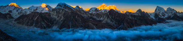 istock Everest sunset glow above clouds Himalaya mountain peaks panorama Nepal 649669932