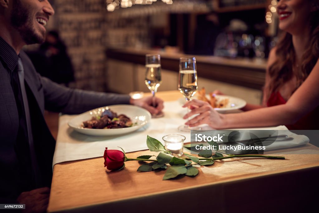 Romantic evening Couple have romantic evening in restaurant Table For Two Stock Photo