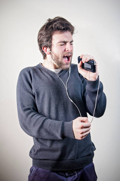 istock Funky man dancing to music on his smartphone 649672496