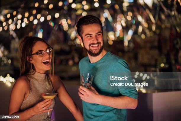 Couple In A Nightclub Stock Photo - Download Image Now - Bar - Drink Establishment, Couple - Relationship, Cocktail Party