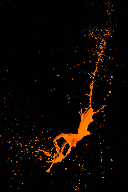 istock isolated orange water splash on background 649676560