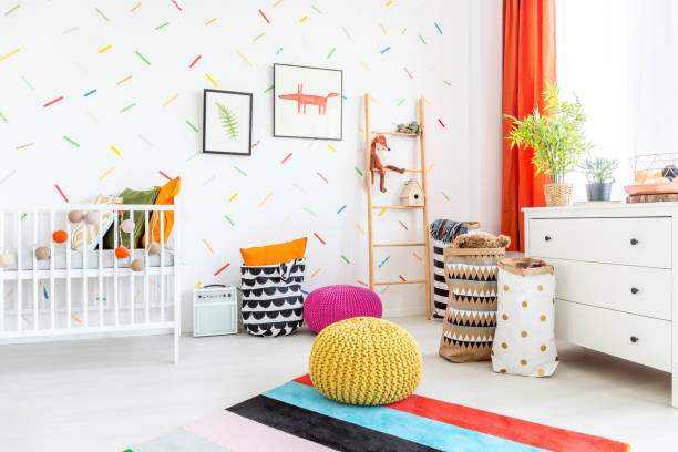 istock Cradle and pouffs in room 649679642