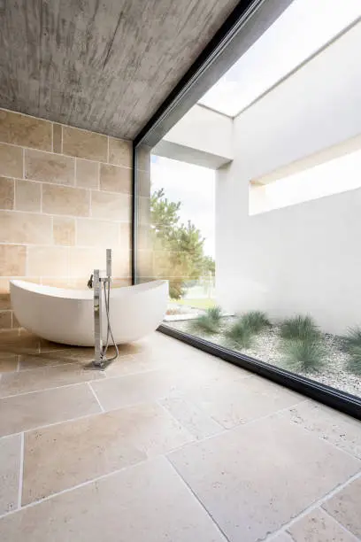 Photo of Minimalistic bathroom with window