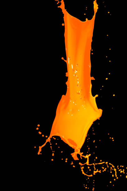 istock isolated orange water splash on background 649684696