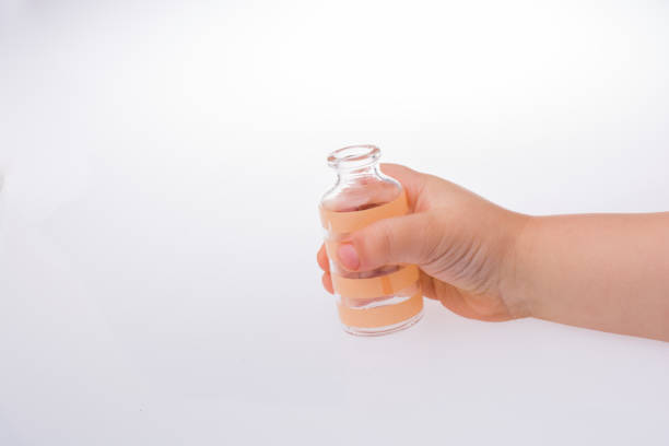 istock Little empty glass bottle in hand 649687296