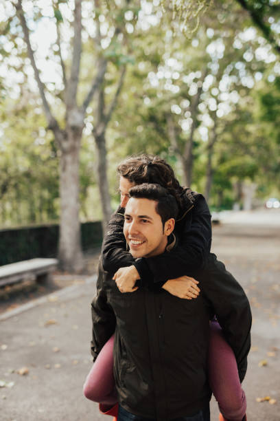 istock Boyfriend giving girlfriend a piggy back ride 649687602