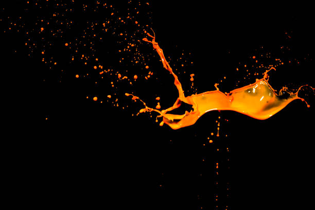 istock isolated orange water splash on background 649688388
