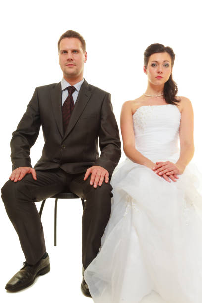 istock Sad groom and bride couple waiting for wedding 649695776