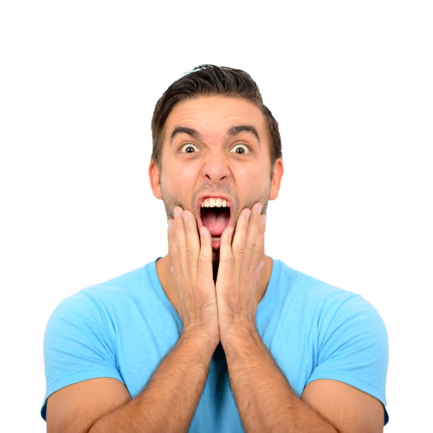 istock Portrait of angry man screaming and pulling hair against white background 649699542