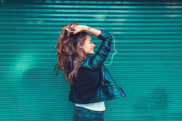 istock Young woman enjoying the music 649699608
