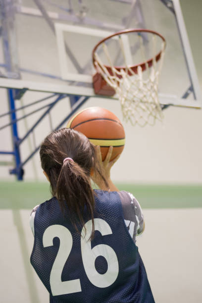 istock Girl playing basketball 649700038