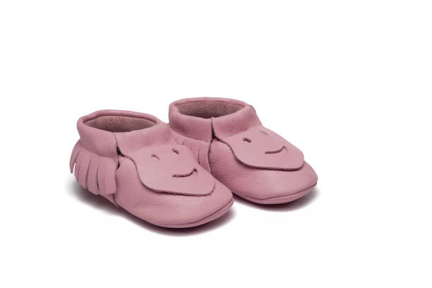 istock Childs light pink booties on a white background 649700888