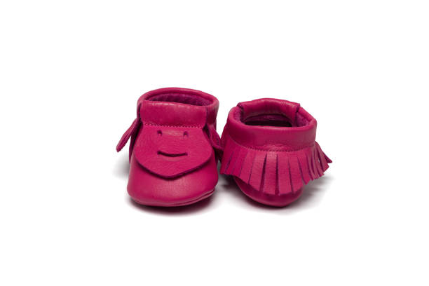 istock Childs dark pink booties on a white background 649700906