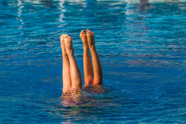 istock Syncronised Swimming Girls Legs Underwater 649704408