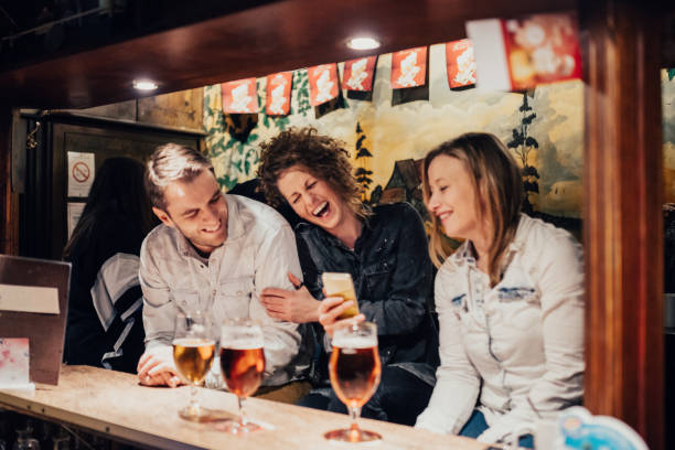 istock Friends having a great time drinking beer in the pub 649711834
