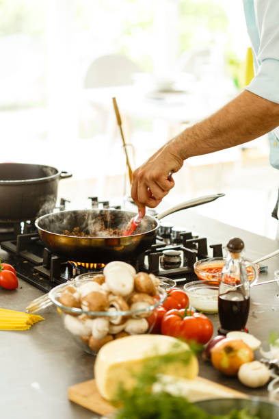 istock Man preparing food in the kitchen 649715002