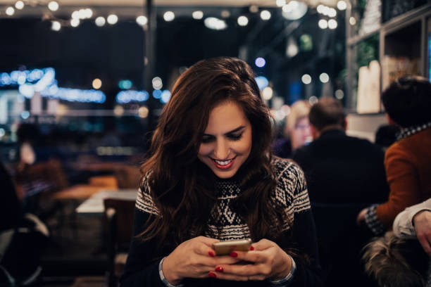 istock Joyfull girl surfing the web from the cafe 649718264