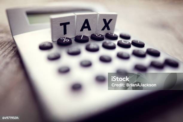 Calculating Tax Stock Photo - Download Image Now - Tax Form, Tax, Income Tax