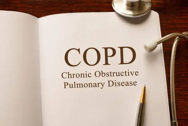 Photo of Page with COPD Chronic obstructive pulmonary disease ,on the table with stethoscope, medical concept