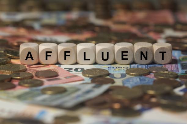 istock affluent - cube with letters, money sector terms - sign with wooden cubes 649725930