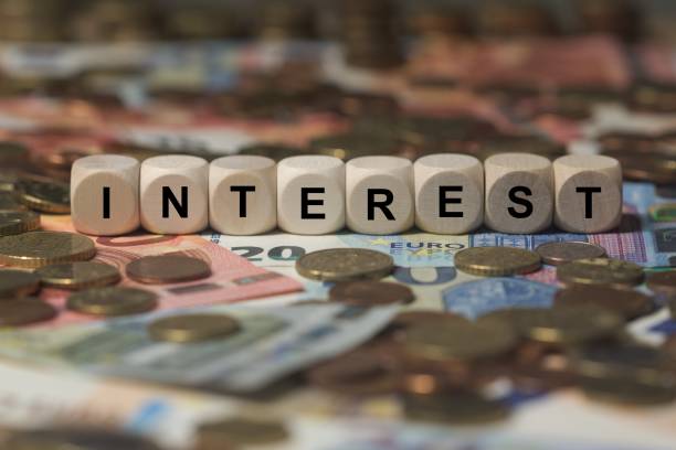 istock interest - cube with letters, money sector terms - sign with wooden cubes 649727576