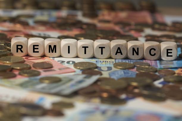 istock remittance - cube with letters, money sector terms - sign with wooden cubes 649730352