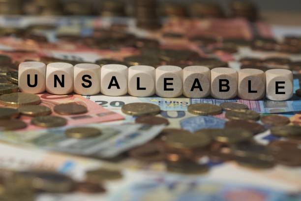 istock unsaleable - cube with letters, money sector terms - sign with wooden cubes 649730632
