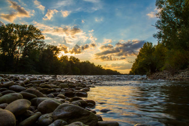 river flow through canyon under a blue cloudy sky