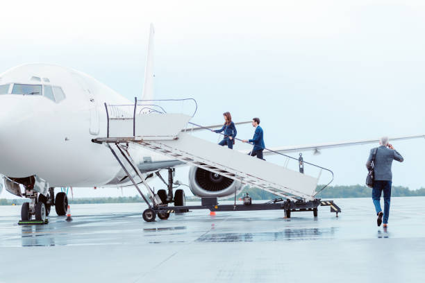 istock Business people entering the airplane 649735124