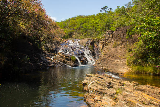 istock Beautiful waterfall in sunny day 649735438