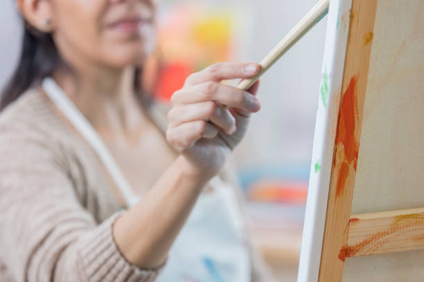istock Confident female artist at work in studio 649736058