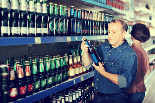 istock Pensioner selecting a beer at the  store 649738536