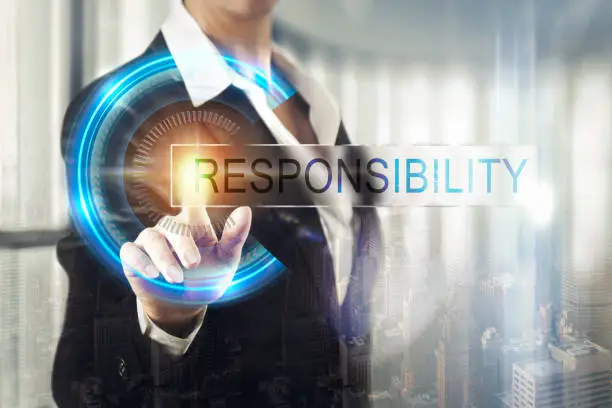 Photo of Business women touching the responsibility screen