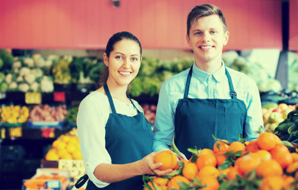 istock Stuff in apron selling sweet oranges, lemons and tangerines 649749208