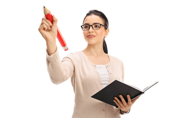 istock Female teacher writing with a big red pencil 649749712