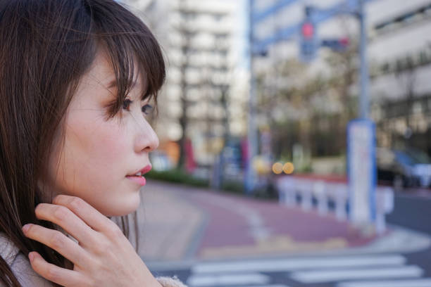 istock Young woman relaxing in a park 649750132