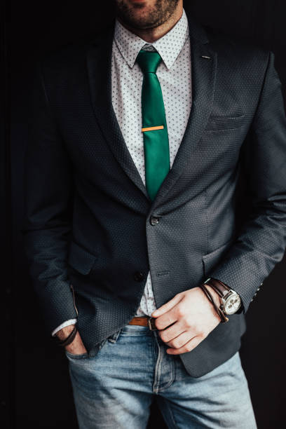 istock Man in a suit on a black background 649757478