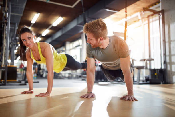 istock Female and male doing exercises for strengthen hands 649765784